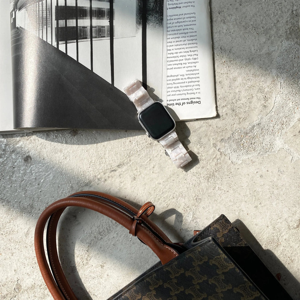 White shell pattern environmentally friendly resin Apple Watch strap shown on Apple Watch