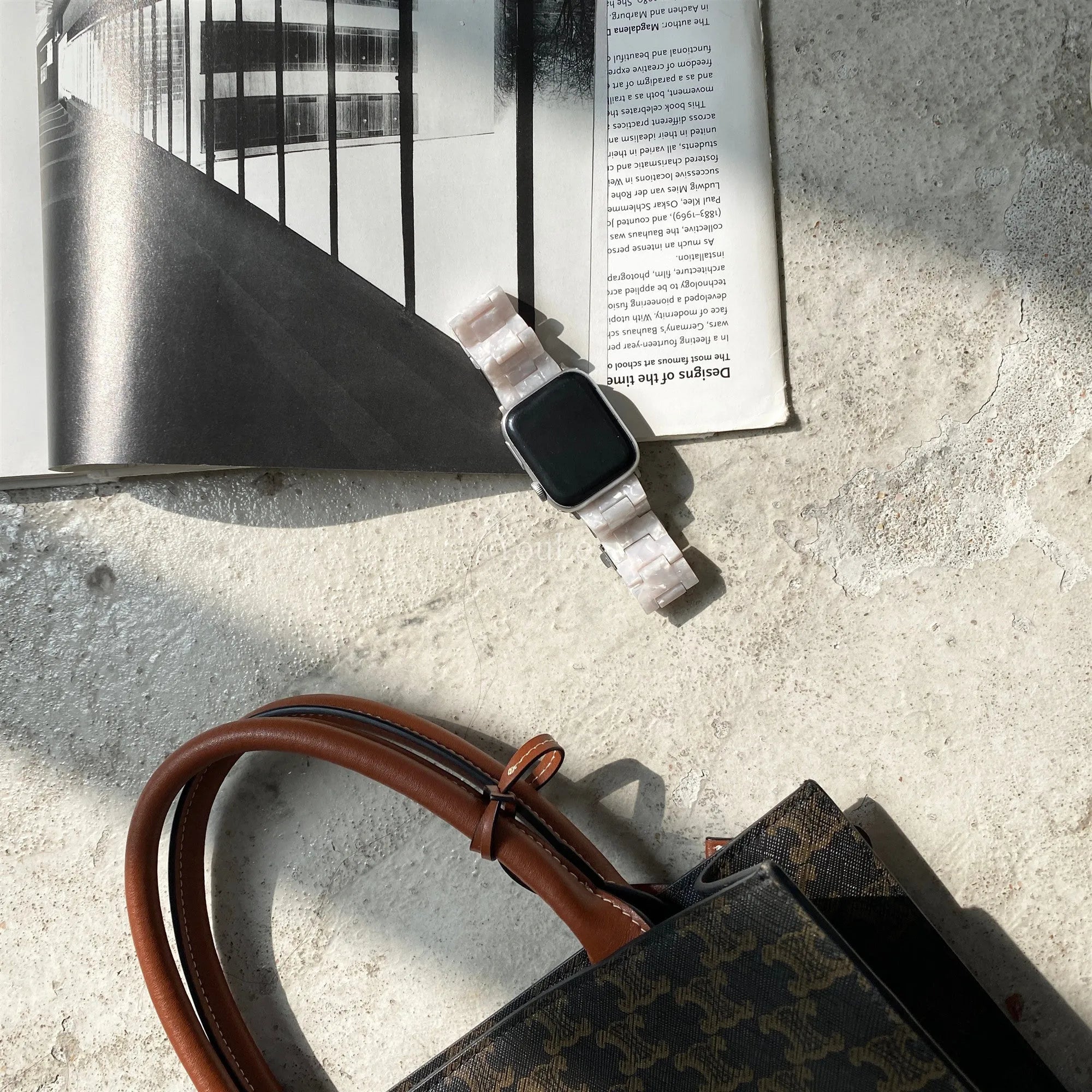 White shell pattern environmentally friendly resin Apple Watch strap shown on Apple Watch