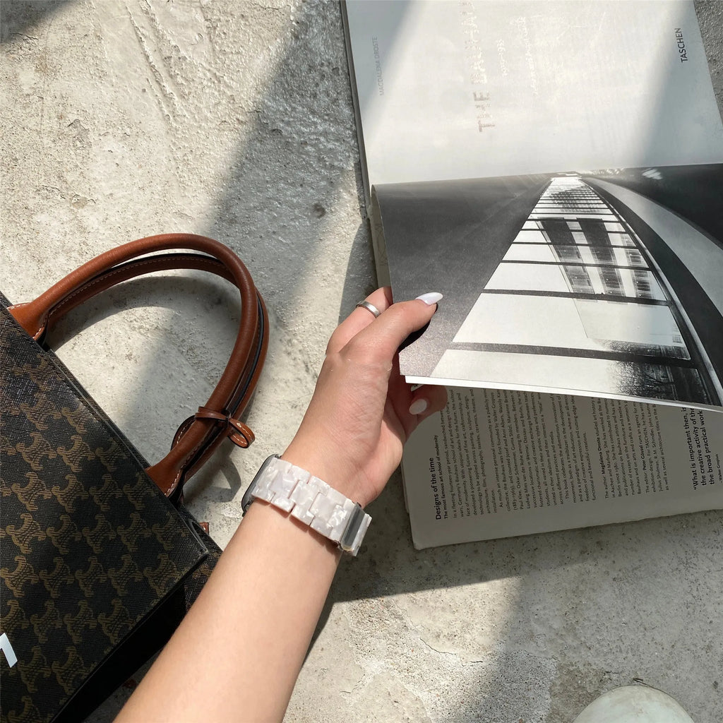 White shell pattern environmentally friendly resin Apple Watch strap shown on Apple Watch