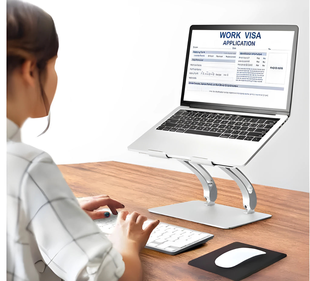 Folding aluminium alloy laptop and tablet stand on a desk, shown in black colour with a laptop placed on top.