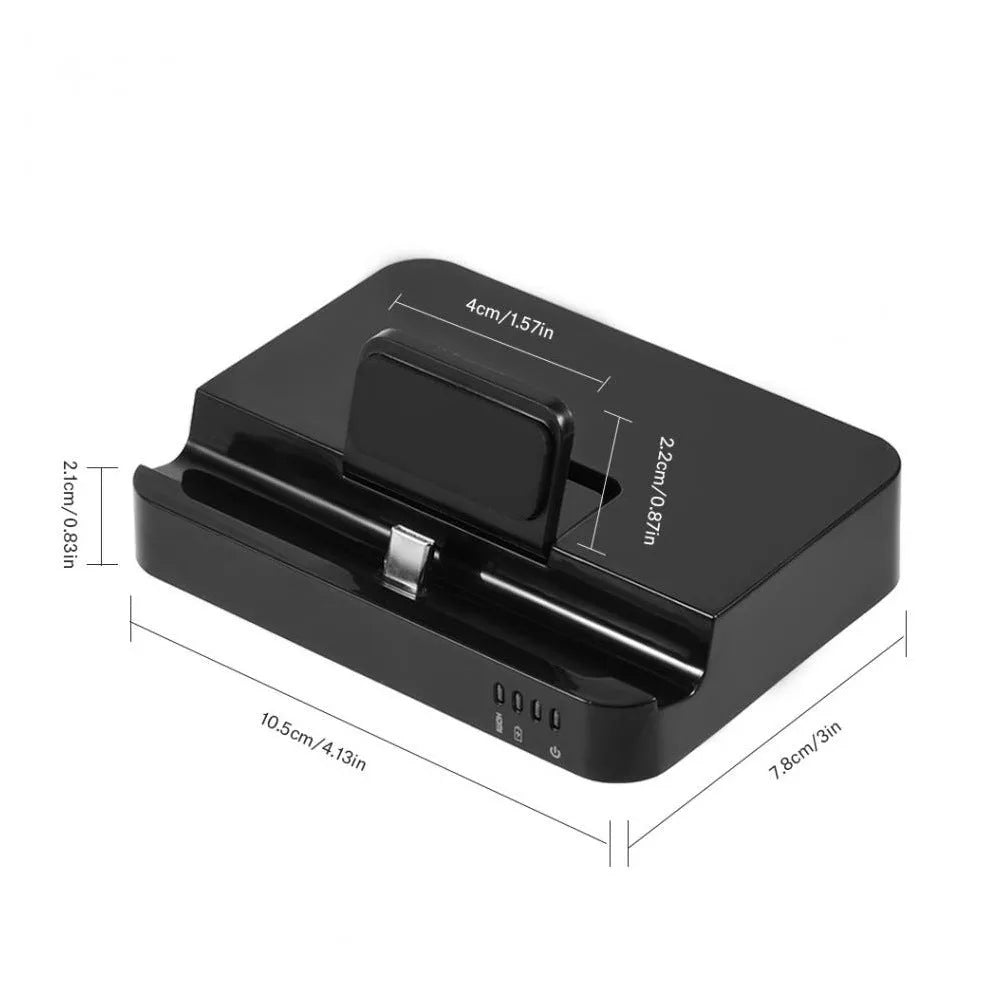 Black mobile phone dock converter with HDMI and USB ports on a wooden desk