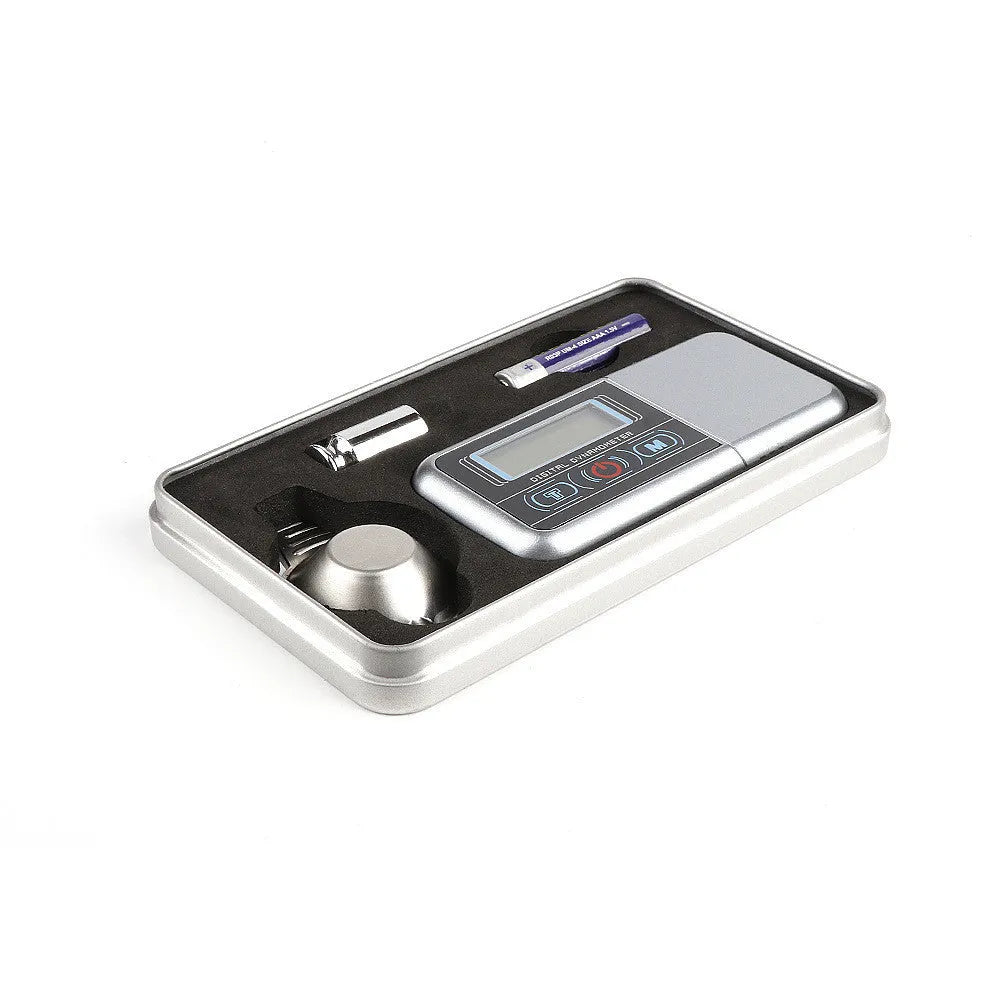 Electronic precision scale with digital display for weighing small items up to 100 grams.