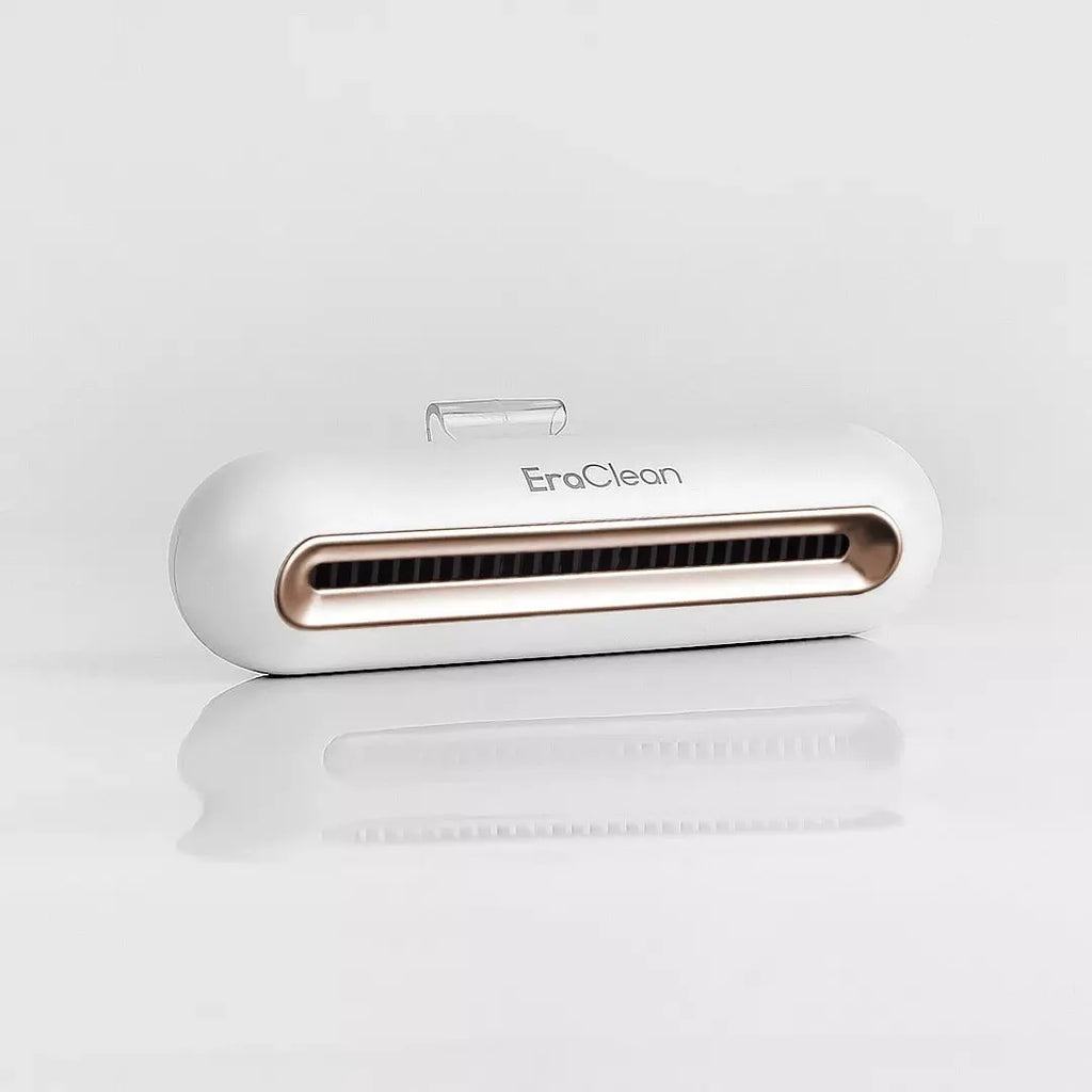 Rose gold USB car air purifier with activated carbon filter for deodorising and sterilising.