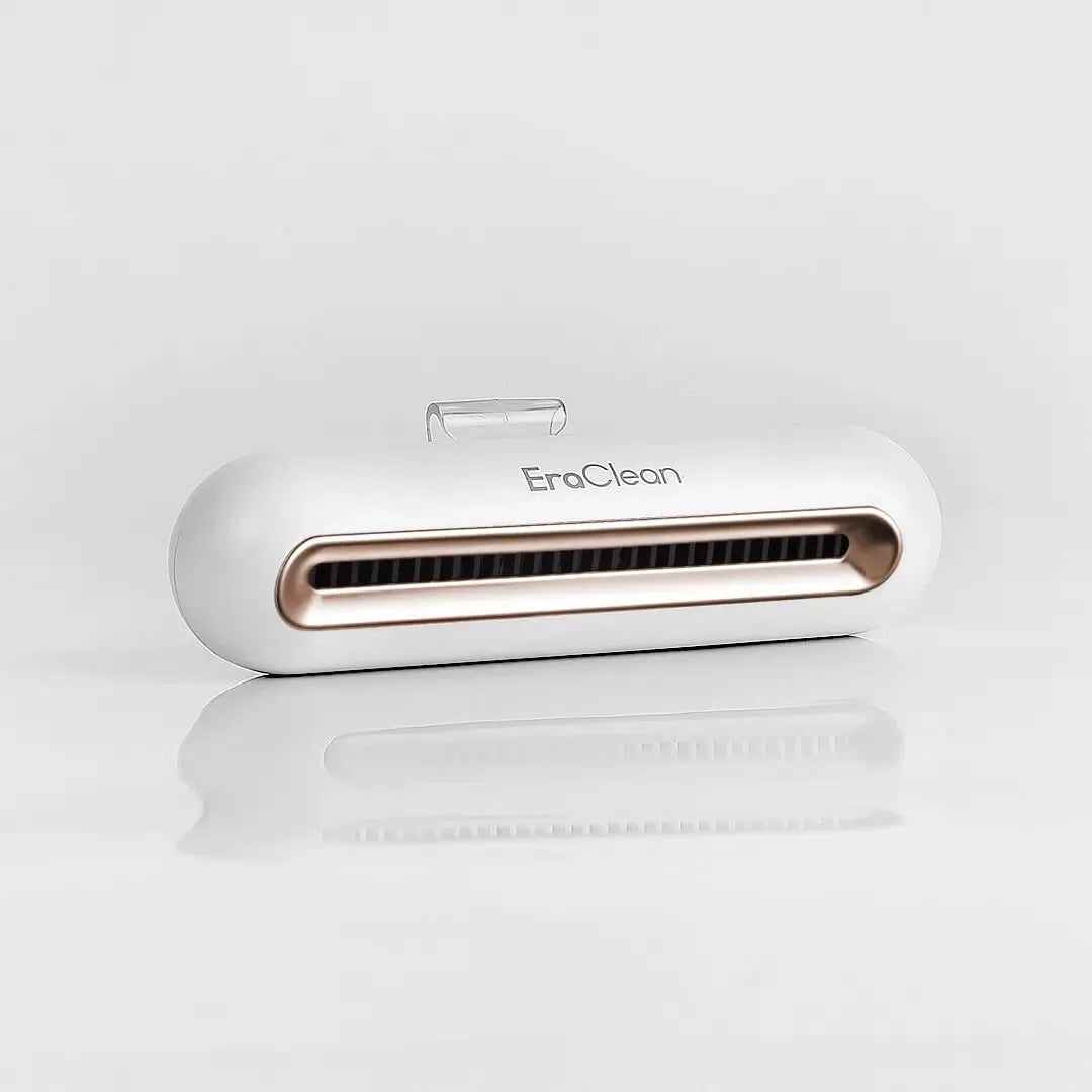 Rose gold USB car air purifier with activated carbon filter for deodorising and sterilising.