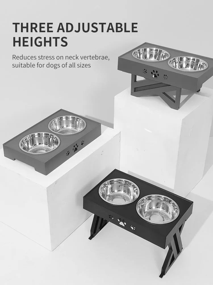 Black folding pet bowl with stainless steel interior and plastic outer shell on surface