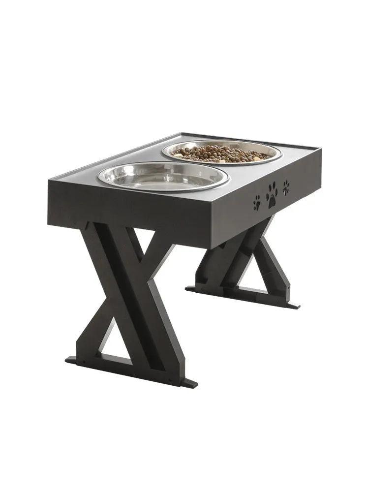 Black folding pet bowl with stainless steel interior and plastic outer shell on surface