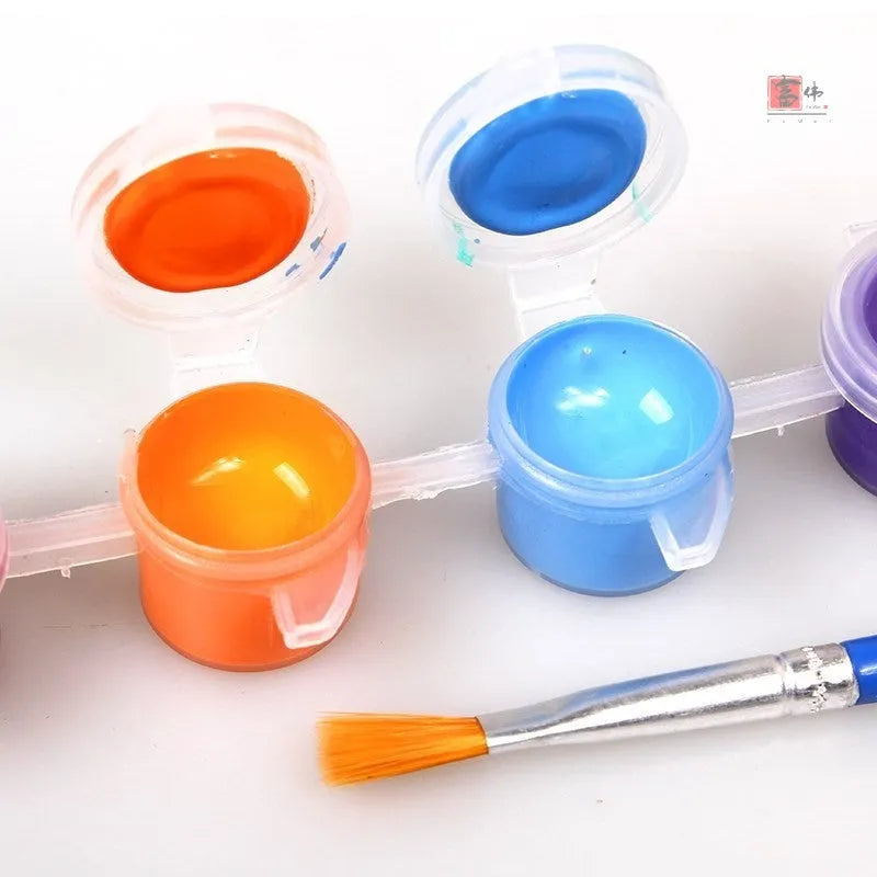Children's one-time use gouache painting drawing board kit with sketchpad, paint pots, and brushes.