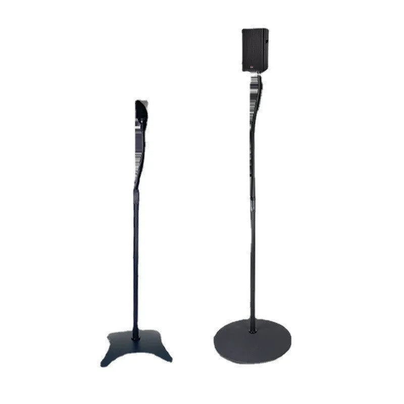 Black tripod speaker stand with universal hanger mount for bookshelf speakers on a wooden floor.