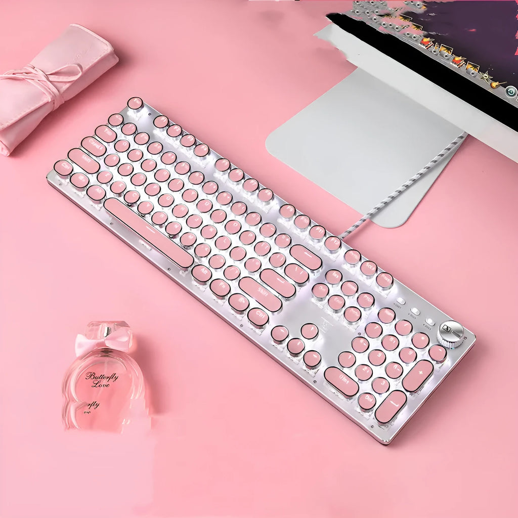 Queen Lipstick mechanical keyboard with green switches, white backlight, silver base, and pink accents on a desk