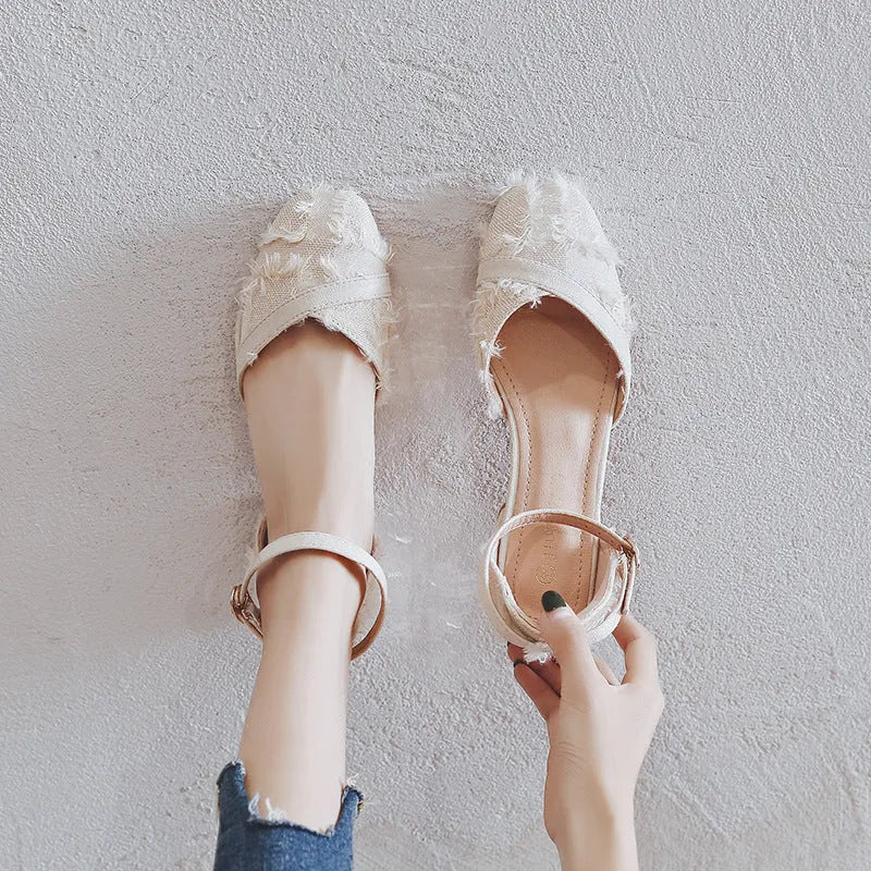 Women's apricot suede D'Orsay flats with an ankle strap and a 3cm low heel on a plain background.
