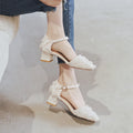 Women's apricot suede D'Orsay flats with an ankle strap and a 3cm low heel on a plain background.