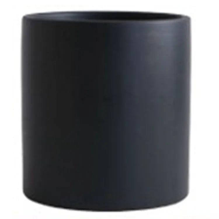 Nordic style cylindrical ceramic cube planter for succulents, shown in a selected colour with visible drainage hole.