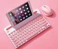 Wireless Bluetooth keyboard and mouse set in pink with storage bag