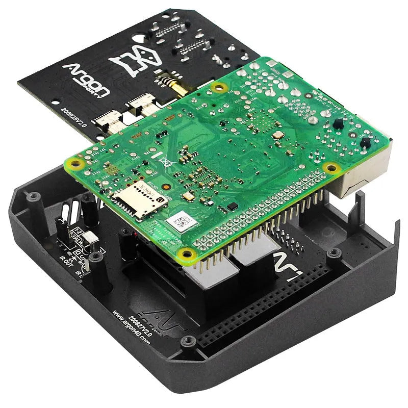 Argon One M.2 SSD expansion board inside an aluminium protective case with cooling fan visible.