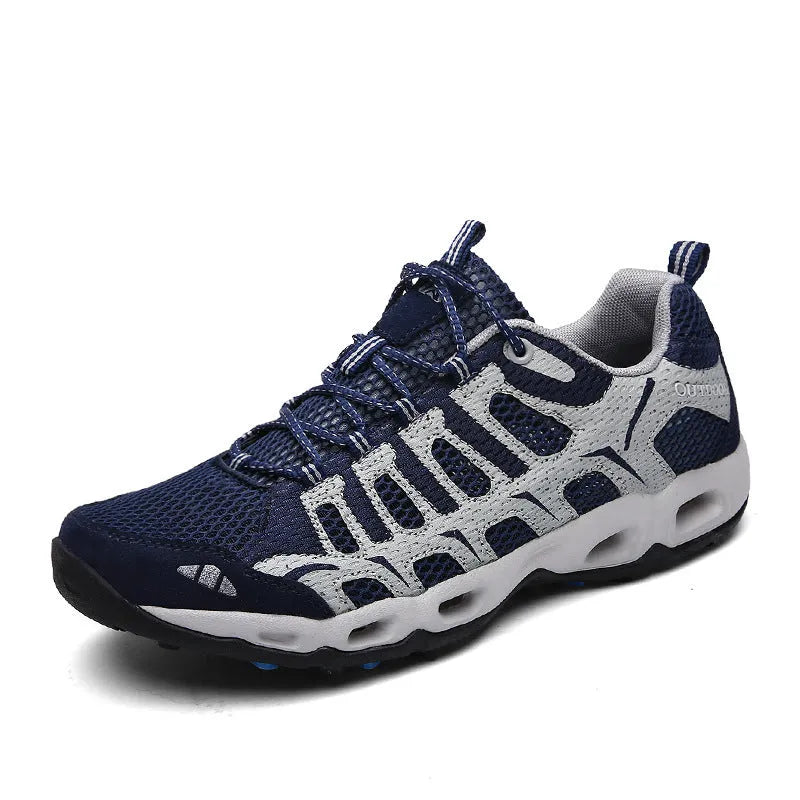 New summer men's travel shoes with hollow mesh upper and rubber sole in grey colour