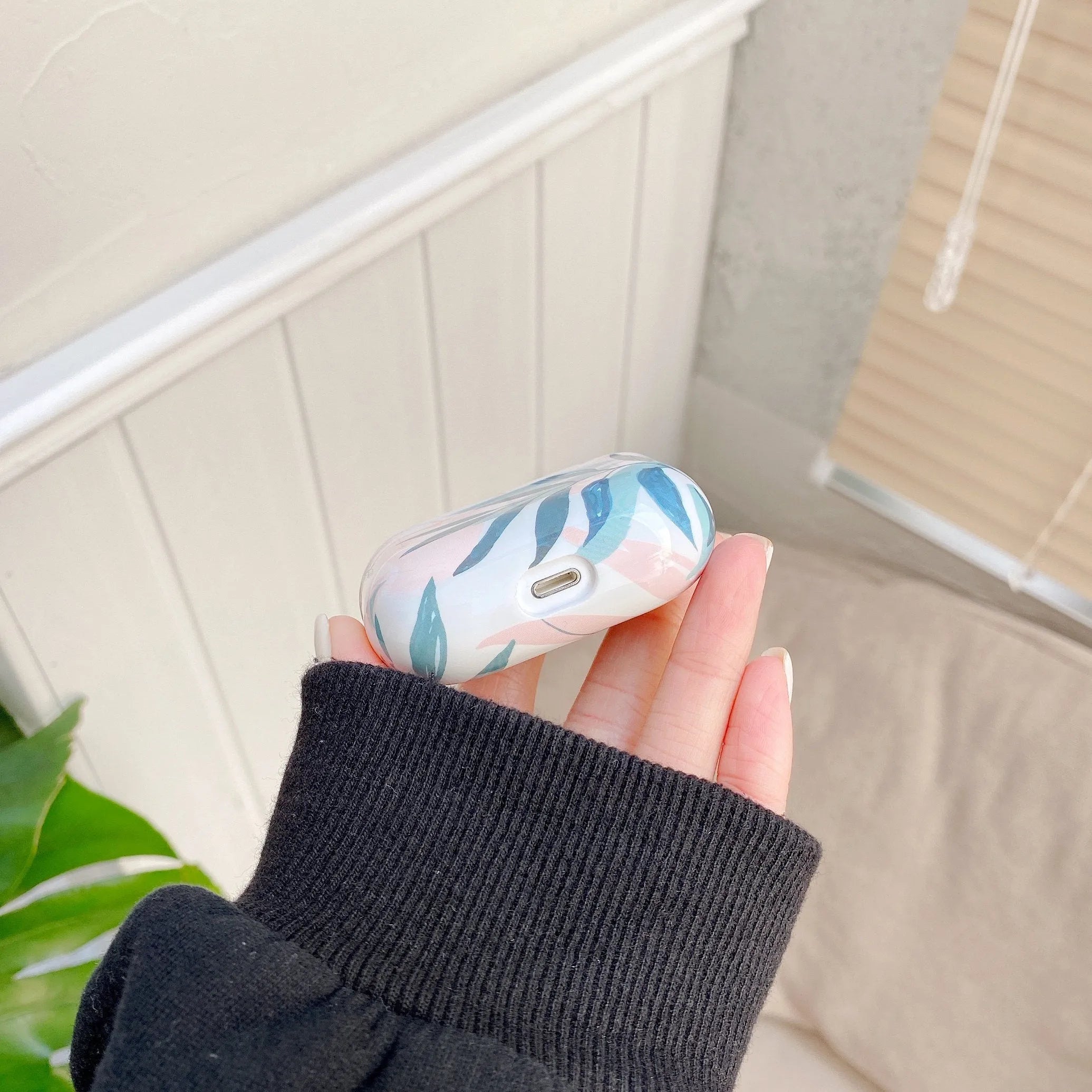 Blue and green banana leaf design soft TPU case for Apple AirPods and AirPods Pro.