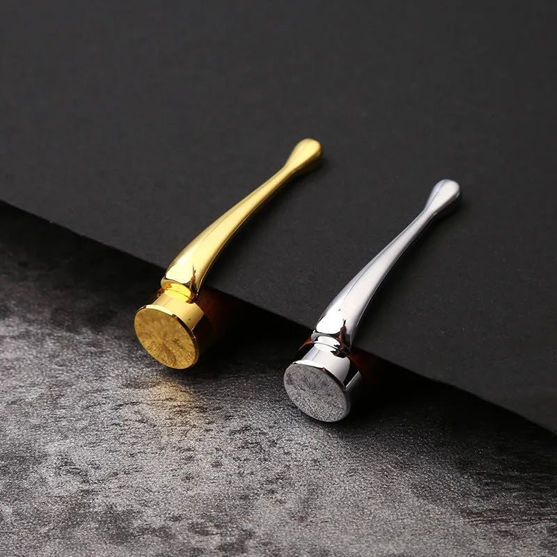 Gold metal and rosewood rollerball pen on a desk, 14cm long