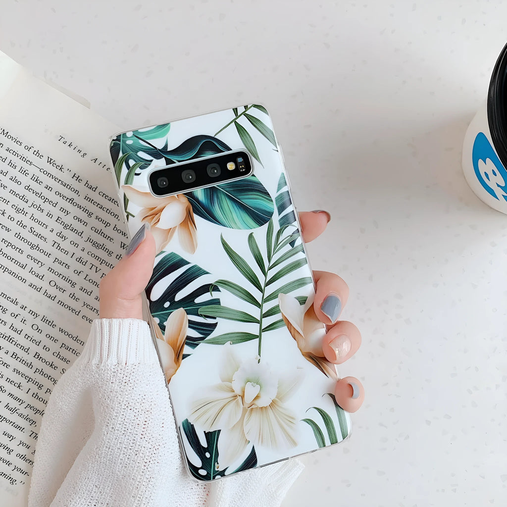 Samsung TPU phone case with green leaf flower design on a Safflower coloured back cover.
