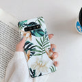 Samsung TPU phone case with green leaf flower design on a Safflower coloured back cover.