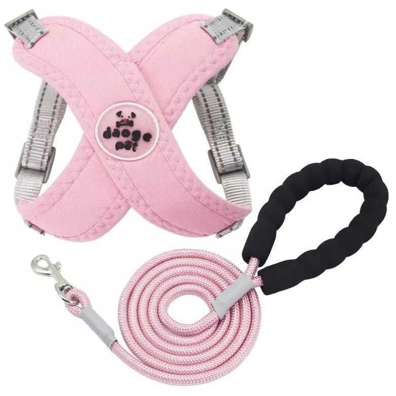 Pink polyester dog harness and bungee rope lead set shown on a size chart.