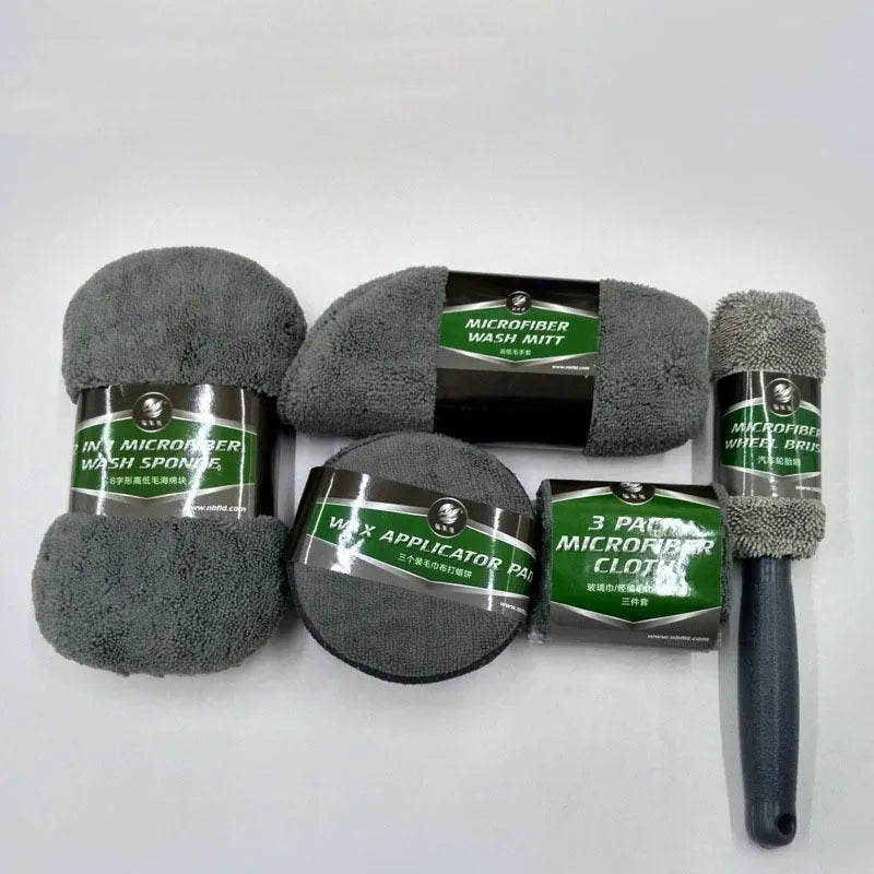 9-piece car wash cleaning kit with polyamide towels, sponge, tyre brush, and waxing cakes in dark grey and orange