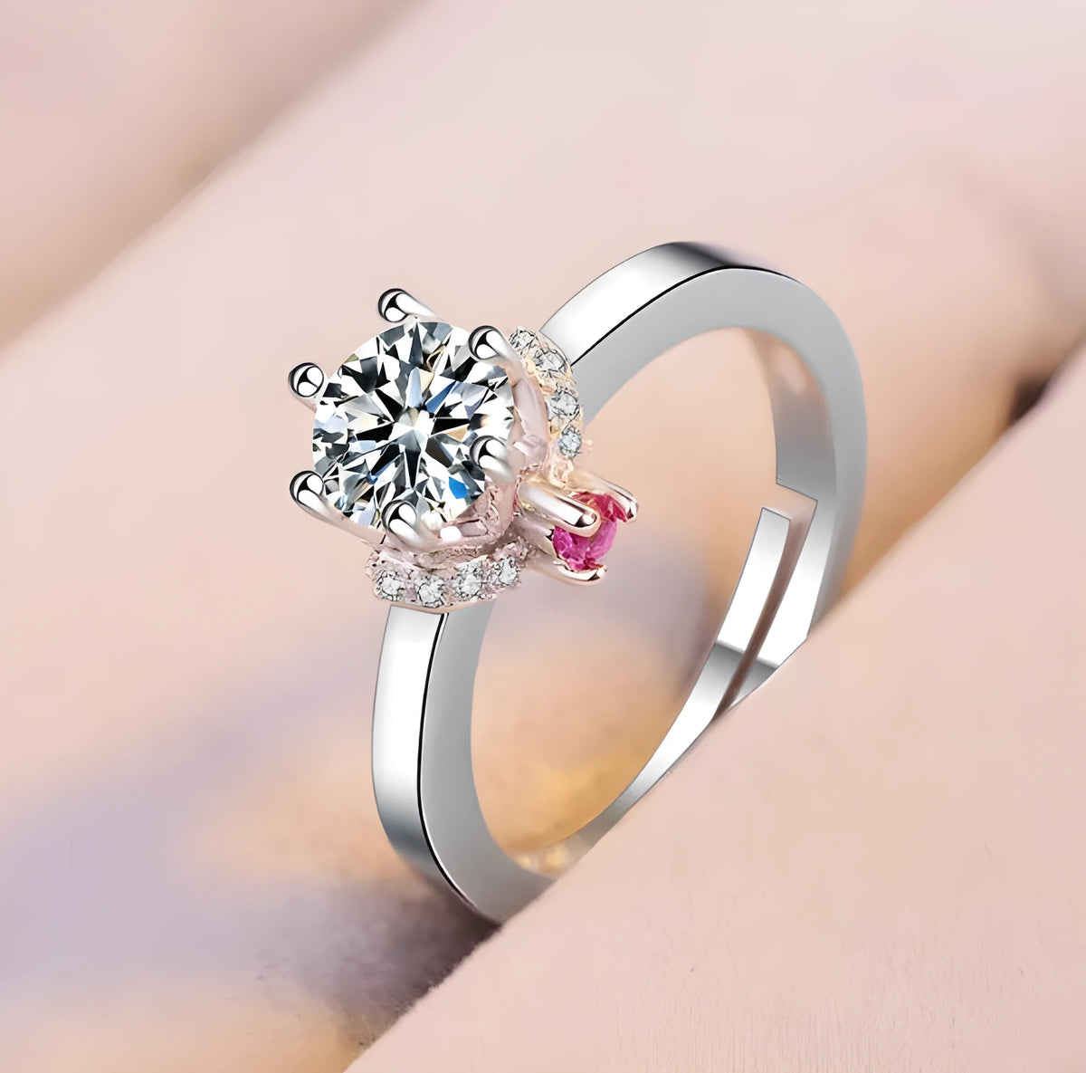Classic six claw simulated diamond engagement ring plated in 18k white gold with round cut centre stone.