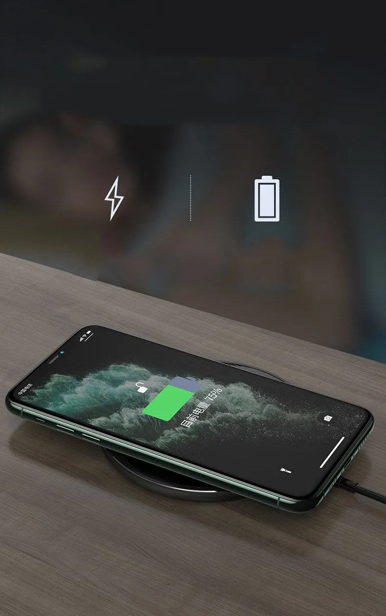 Black circular wireless disc charger for mobile phones with LED indicator light