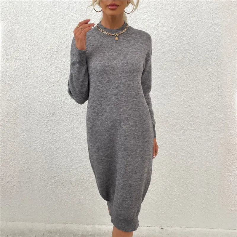 Grey women's crew neck long sleeve acrylic pullover sweater.