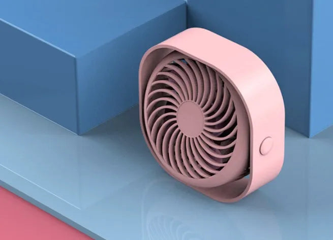 USB desk fan with 360-degree rotation in alarm clock style on a desk