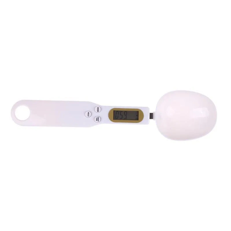 White digital kitchen spoon scale with LCD display showing weight measurement