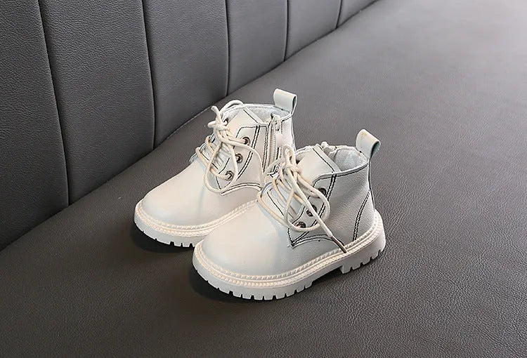 Boys leather short boots with synthetic upper and rubber sole in beige colour, side view