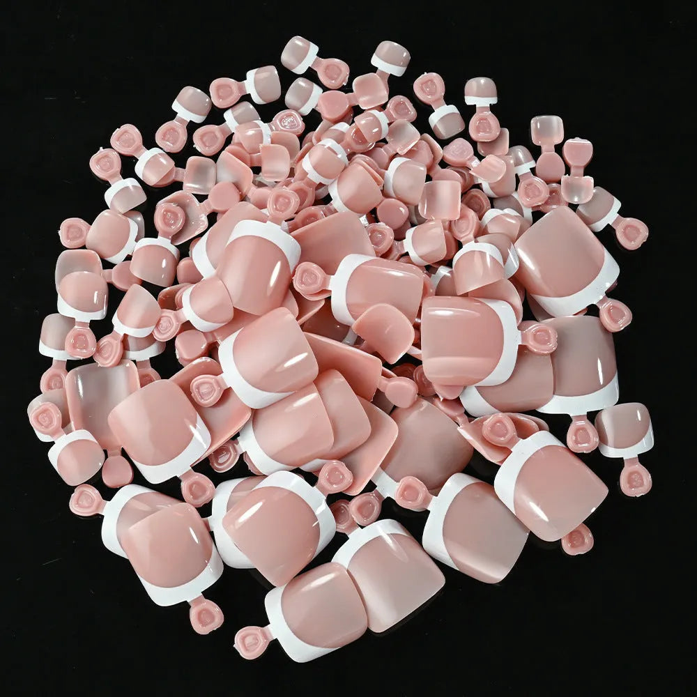 120-piece box of French white edge full square short acrylic nail tips in nine nude colours.