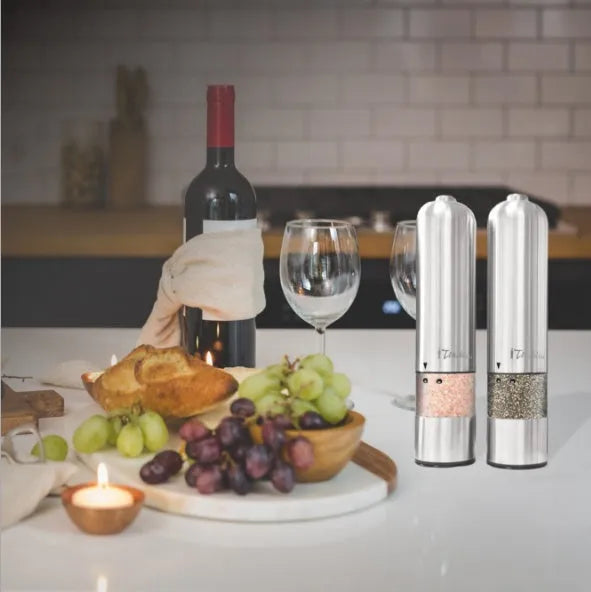 Stainless steel electric pepper grinder on kitchen counter