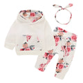 White cotton hooded tracksuit set for a baby girl, showing long sleeves and full-length trousers.