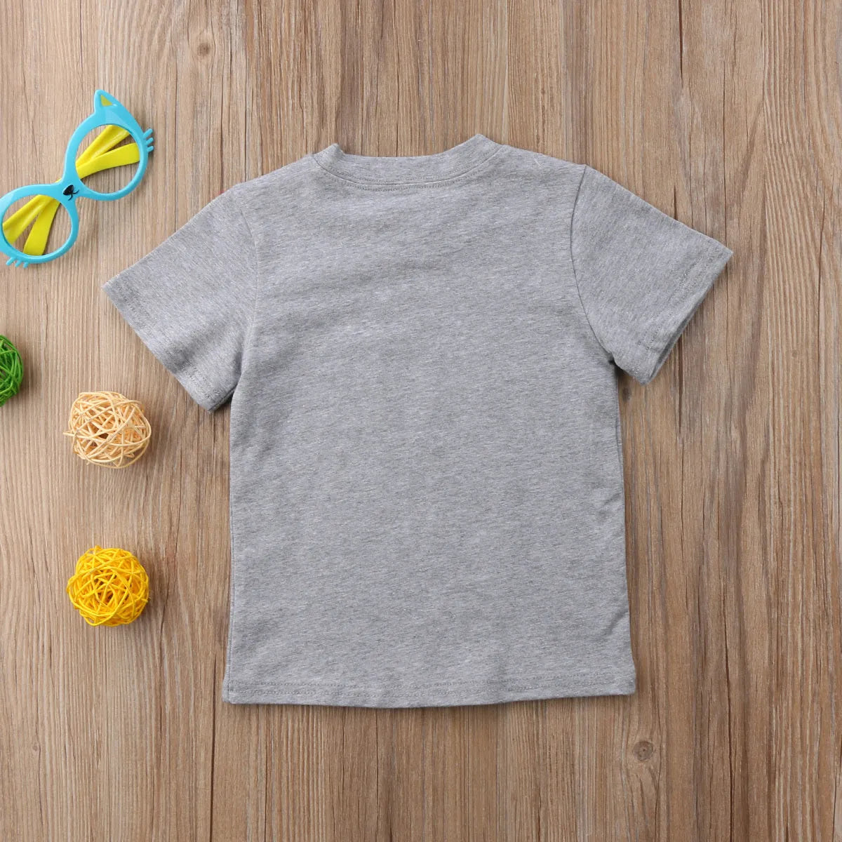 Grey children's cotton t-shirt with sibling print, shown in Asian children's sizes.