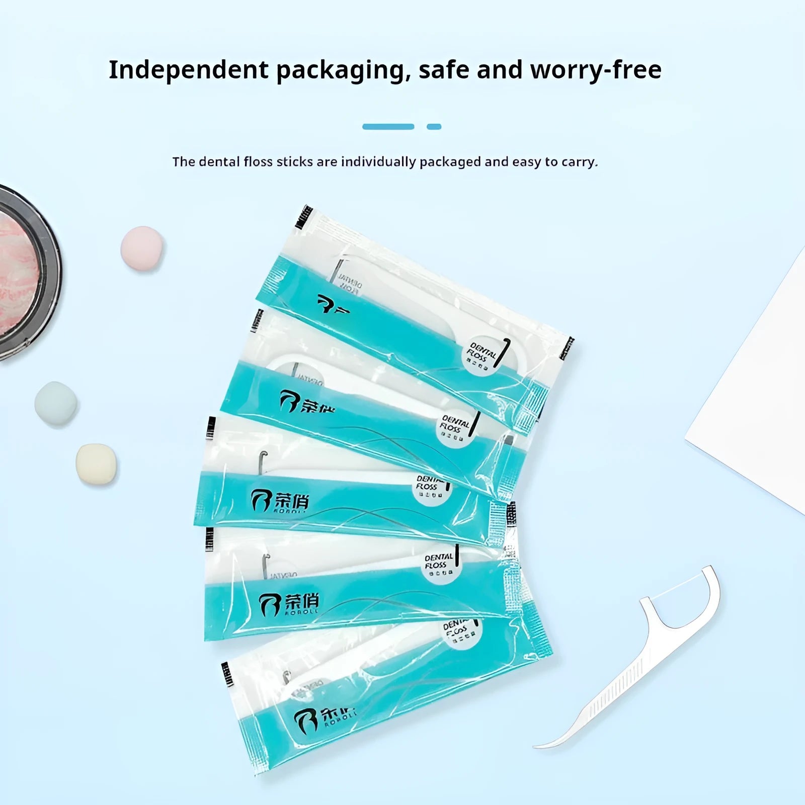 High tensile plastic bag containing disposable floss picks, showing 100 single packs limited offer.