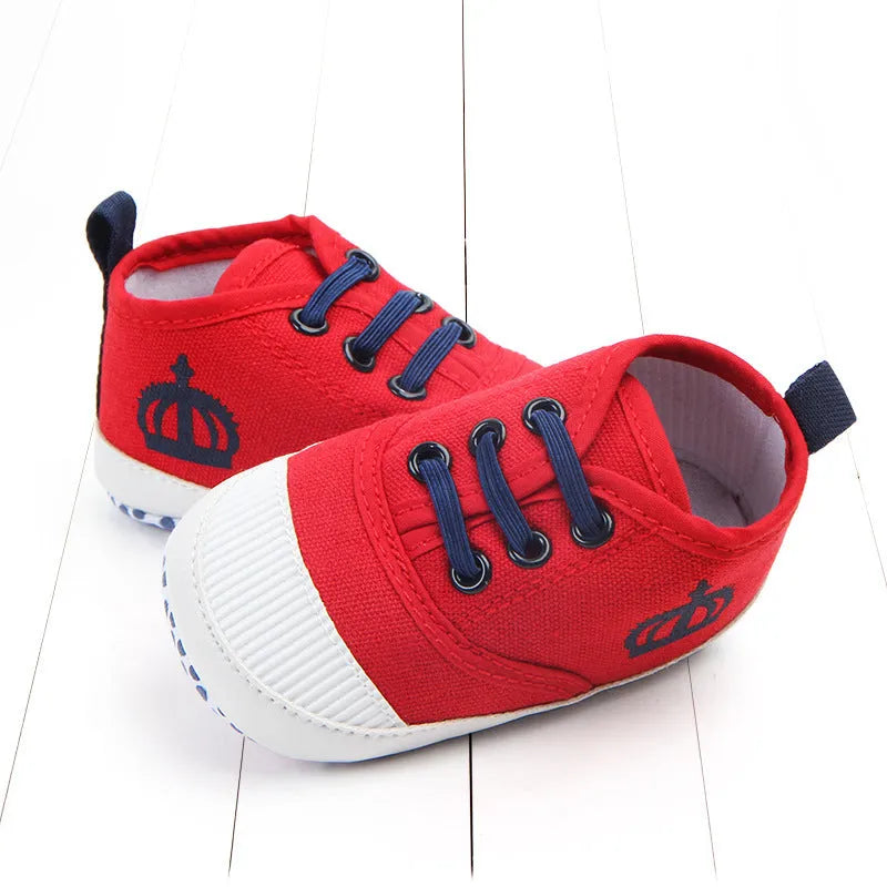 Red and white cotton canvas toddler shoes with elastic band closure in three size options