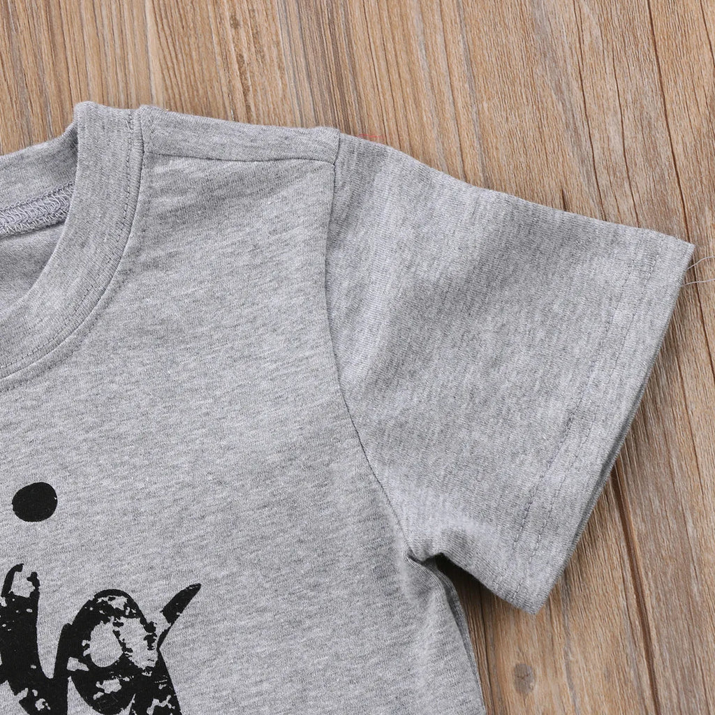 Grey children's cotton t-shirt with sibling print, shown in Asian children's sizes.