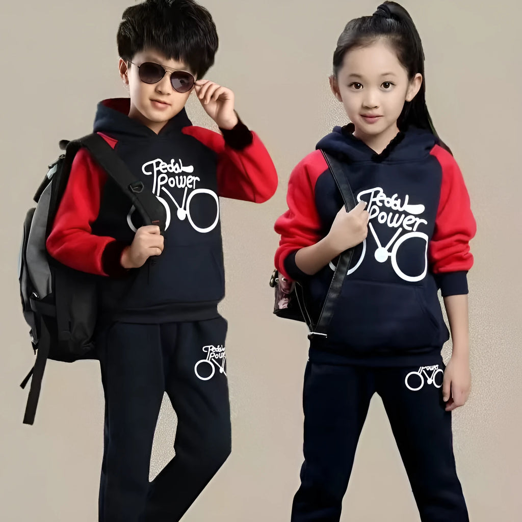Children's black tracksuit set with printed design, showing jacket and trousers laid flat