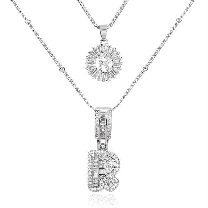 26 English letters copper-plated gold diamond initial pendant necklace with adjustable chain on display