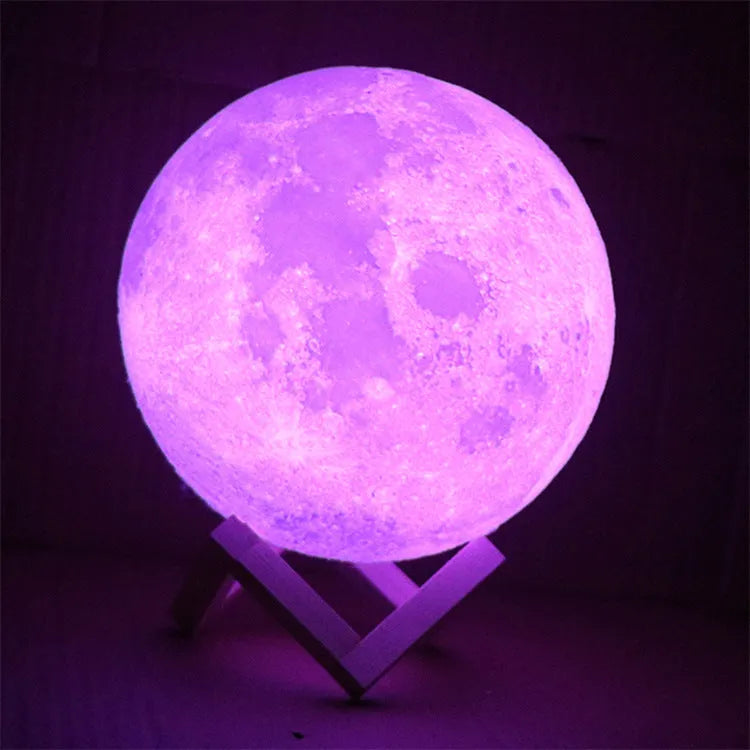 3D printed white moon lamp with detailed craters on a wooden holder, showing touch ring at base.