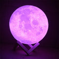 3D printed white moon lamp with detailed craters on a wooden holder, showing touch ring at base.