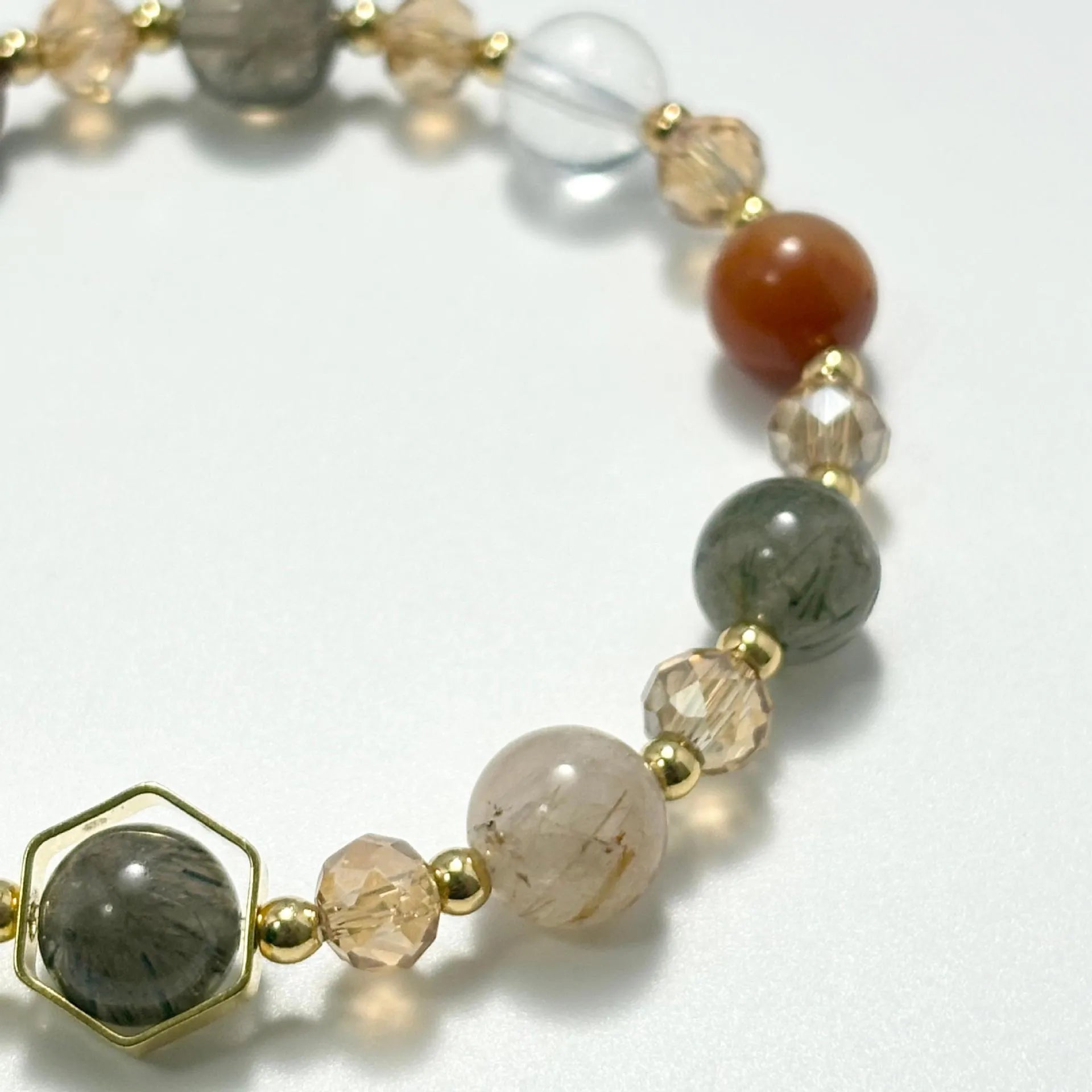 Gold-coloured hand-woven citrine bracelet with auspicious symbols and 8mm beads.
