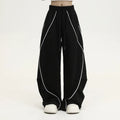 Black striped hip hop trousers with pleated wide-leg design for dance and casual wear