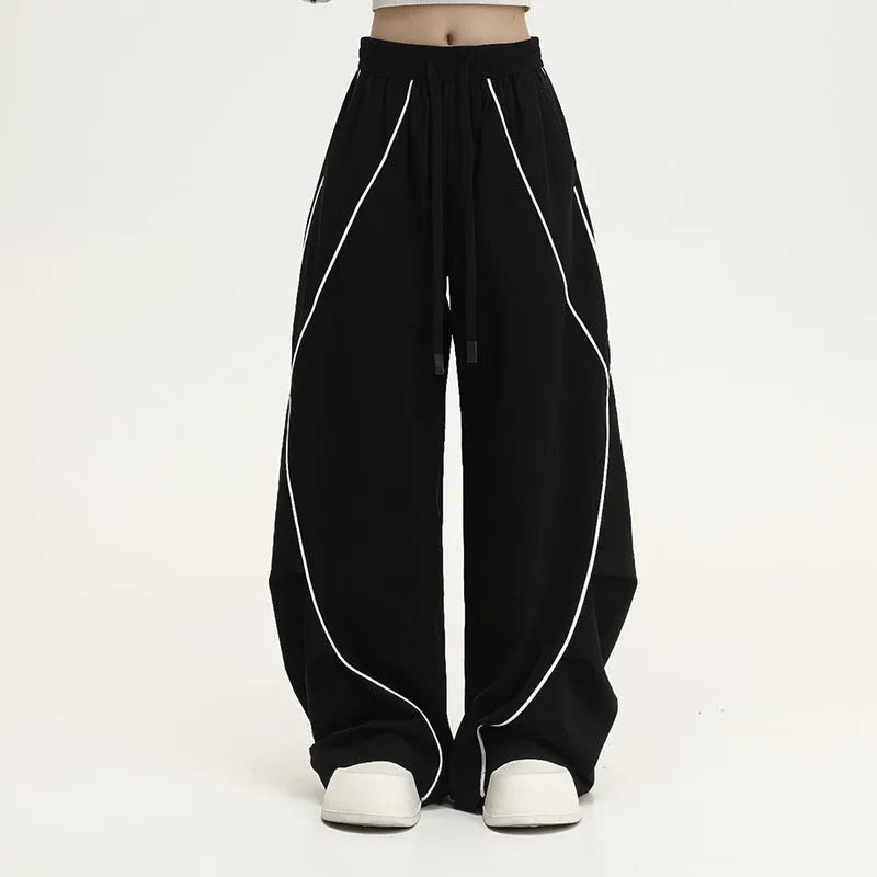 Black striped hip hop trousers with pleated wide-leg design for dance and casual wear