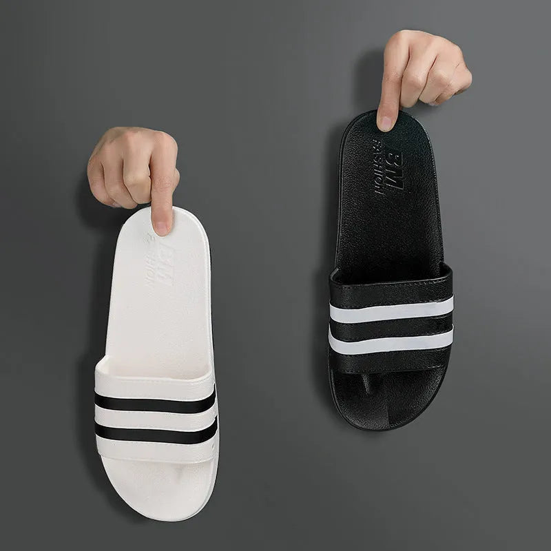 Striped PVC bath slippers for men and women in white with injection-moulded sole, side view