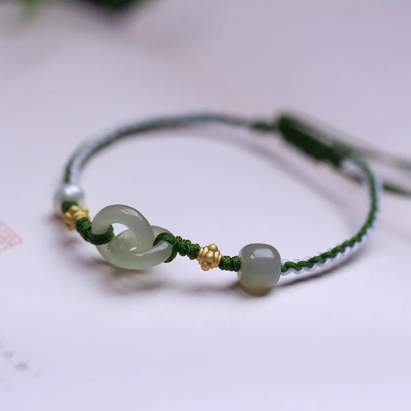 DIY woven bracelet with Hetian jade beads and silver or gold plated metal accents on a flexible wire band.