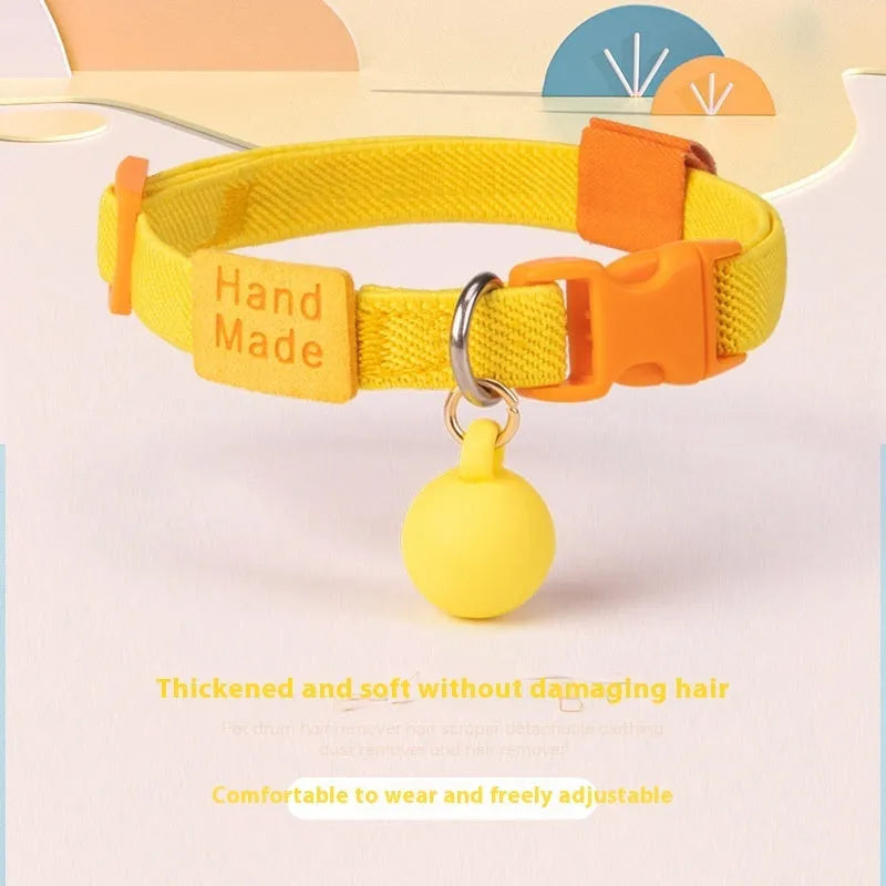 A stretchy, solid-colour polyester dog collar for small breeds, shown in sky blue, adjustable from 22 to 32 centimetres.