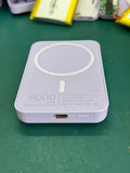 White magnetic wireless power bank showing compact 100x65x16mm dimensions with wireless charging surface