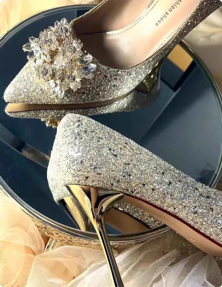 Champagne coloured pointed toe bridal shoes with rhinestone floral pattern on a fine heel.